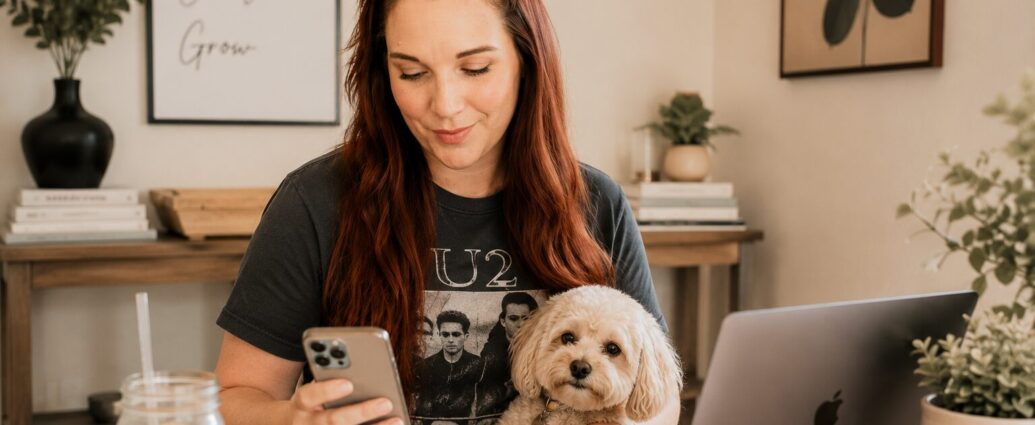 Business owner creating searchable Pinterest Pins on a laptop with keyword research notes and evergreen blog content in a bright home office.