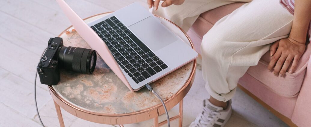 Small business owner building online authority by creating helpful content, recording a podcast interview, and reviewing SEO analytics on a laptop in a bright home office.