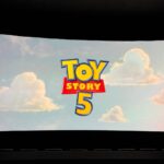 Toy Story 5 movie review featuring Woody, Buzz Lightyear, and Jessie at the movie theater.