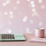 Small business owner working on a laptop while creating searchable content that drives long-term website traffic.Small business owner working on a laptop while creating searchable content that drives long-term website traffic.