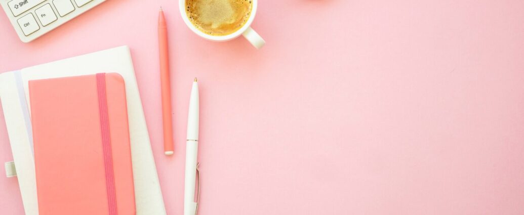 Blogger researching Pinterest keywords and creating pins on a laptop to increase monthly Pinterest views.