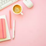 Blogger researching Pinterest keywords and creating pins on a laptop to increase monthly Pinterest views.