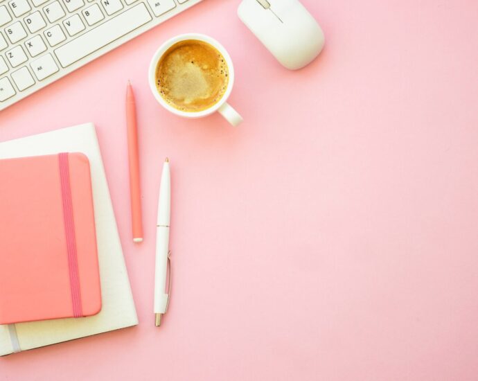 Blogger researching Pinterest keywords and creating pins on a laptop to increase monthly Pinterest views.