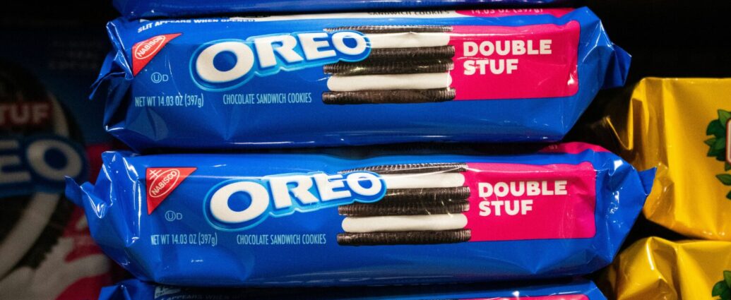 Smartphone displaying Instagram beside Oreo cookies