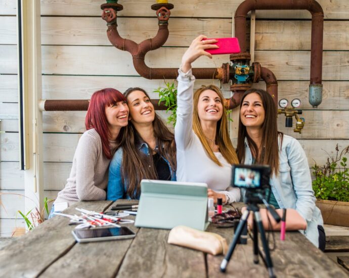 Influencers working in a store creating content for social media together.