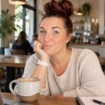 Jessica The Content Maven at a coffee shop working