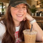 Content creator working at a coffee shop for an article about whether to delete an Instagram post that gets low views