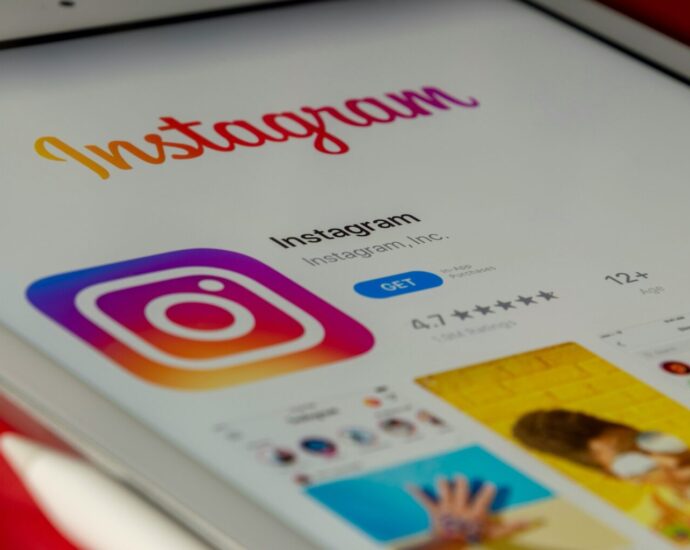 Smartphone displaying an Instagram-style verified account badge.